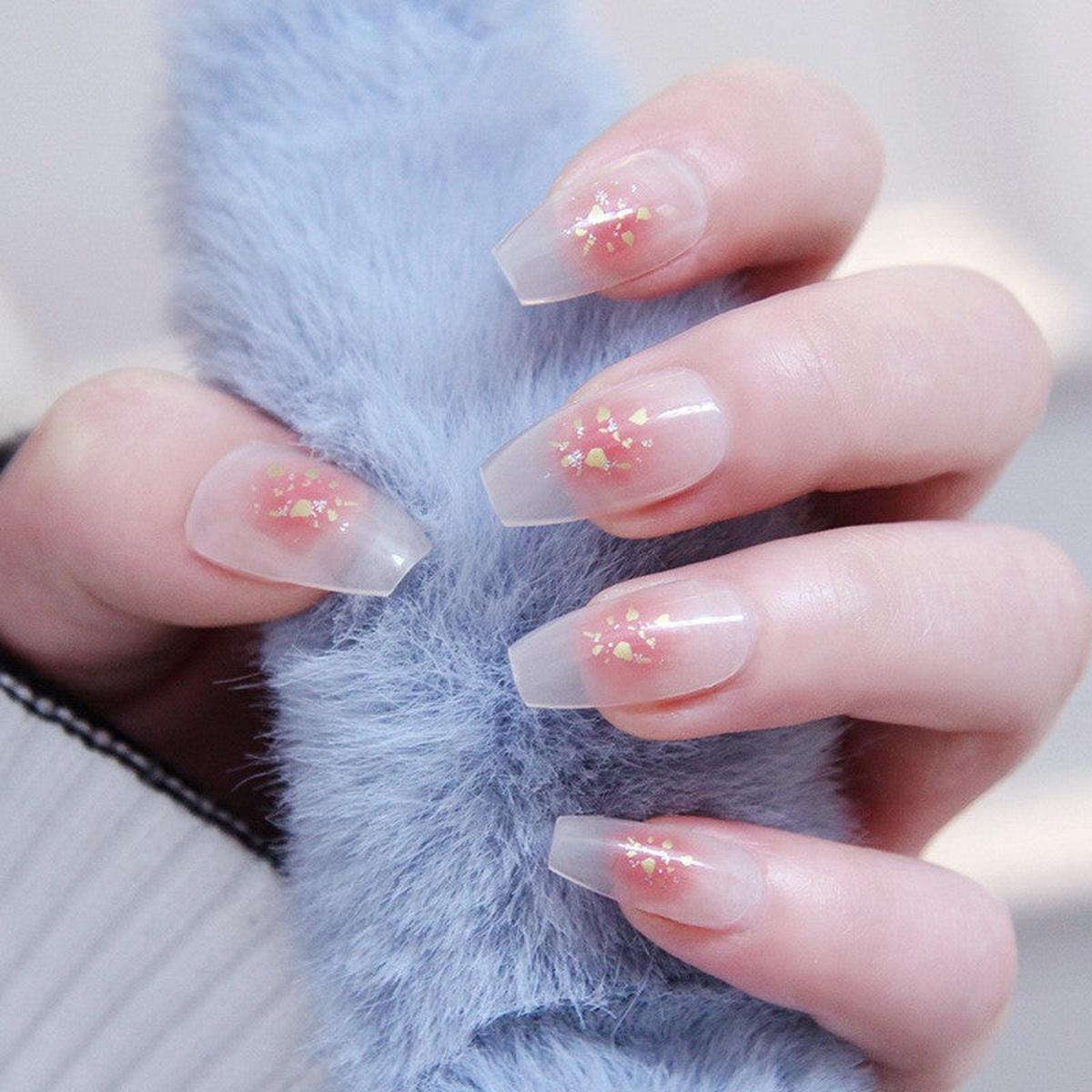 Winter Frost Medium Coffin Clear Press-on Nail Set with Ice Blue Tips and Gold Star Accents