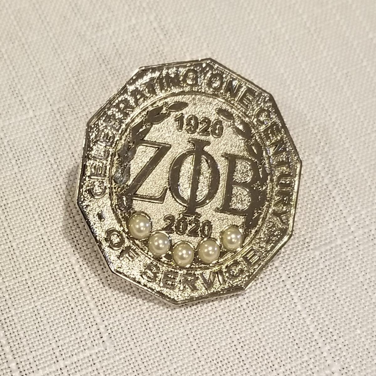 Centennial lapel pin